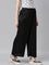 Women Solid Black Mid Rise Shiny Palazzos