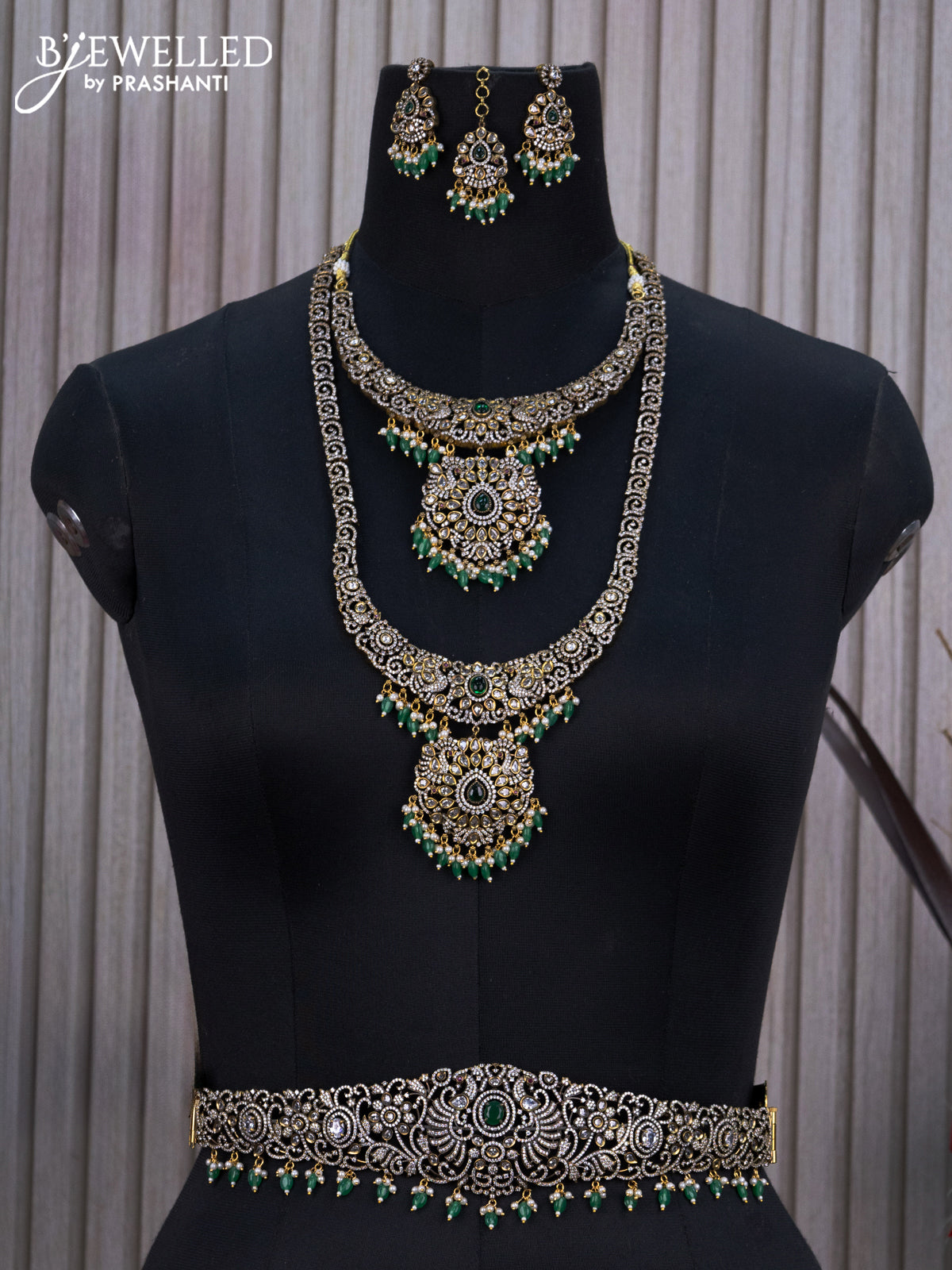 Bridal set with emerald & cz stones and beads hangings in victorian finish