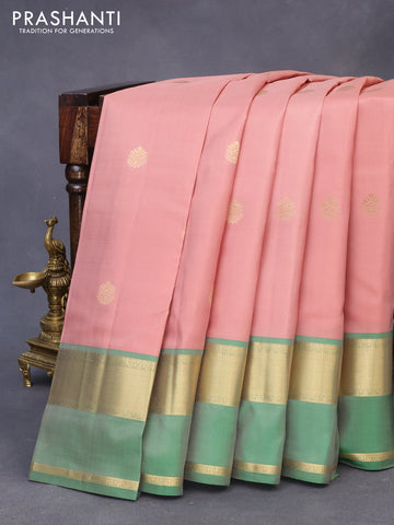 Pure kanchipuram silk saree peach shade and green with zari woven buttas and rettapet zari woven border