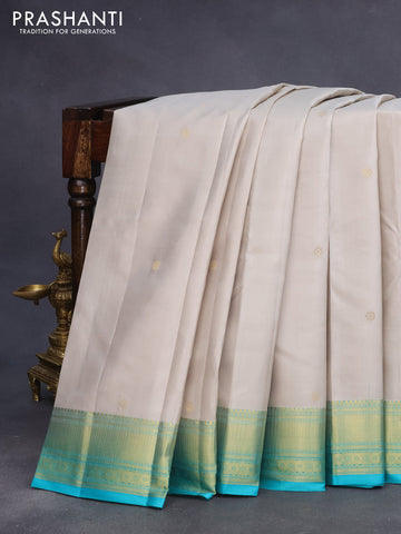 Pure kanchipuram silk saree pastel grey and teal blue with zari woven buttas and zari woven border