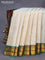 Pure kanchipuram silk saree off white and green with allover zari checks & buttas and zari woven korvai border