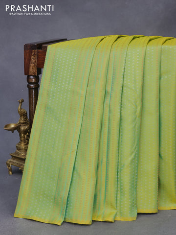 Pure kanchipuram silk saree yellowish green and teal blue with allover zari weaves in borderless style