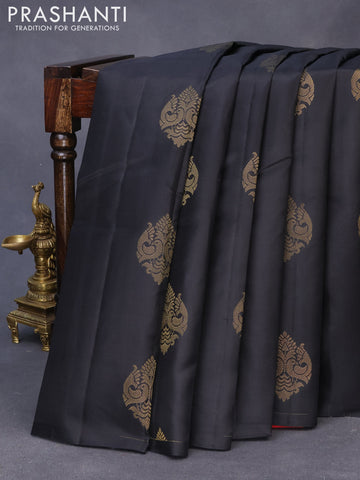 Pure kanchipuram silk saree black and dual shade of pinkish orange with zari woven buttas in borderless style