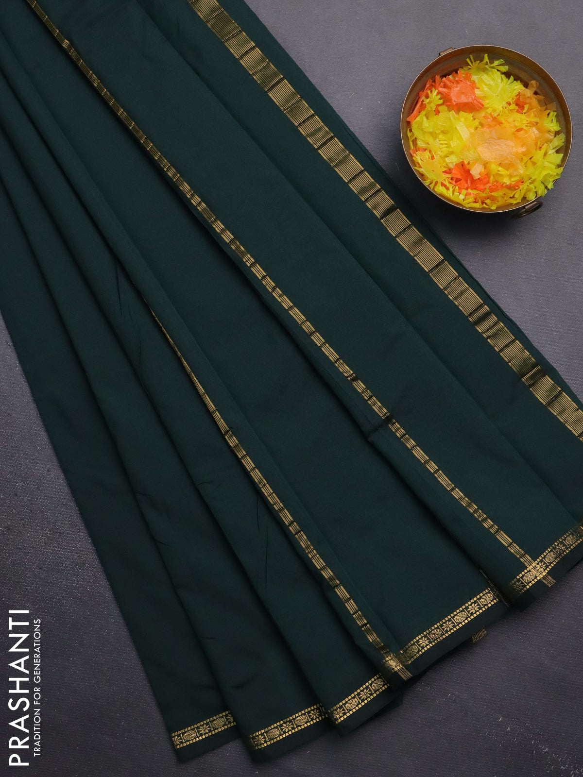 Arani semi silk saree bottle green with plain body and small zari woven border