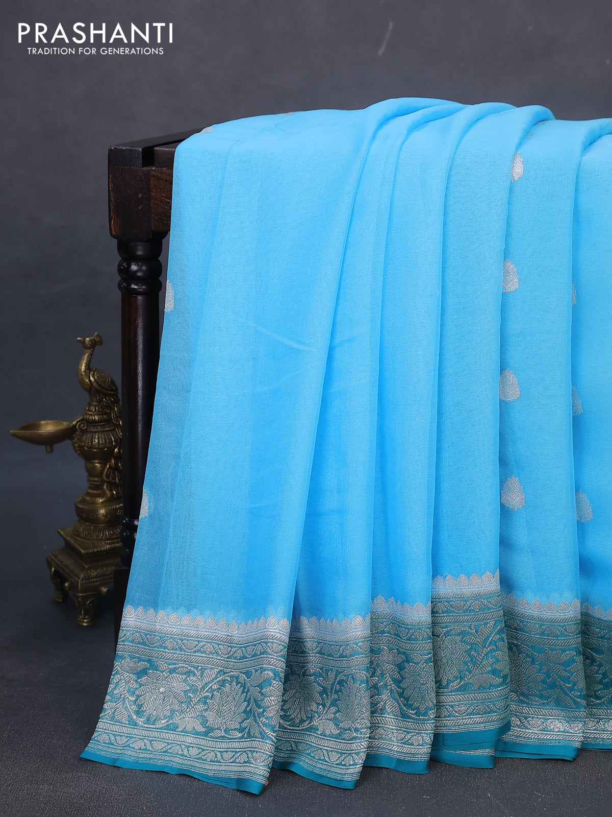 Banarasi chiffon silk saree light blue and teal green with silver zari woven buttas and silver zari woven border