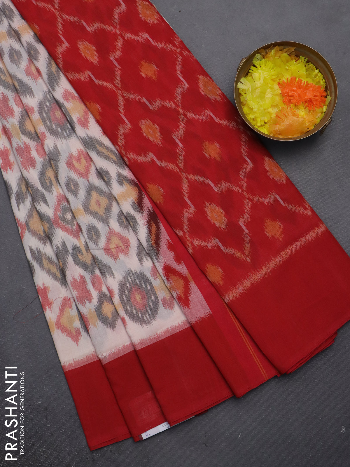 Ikat cotton saree off white and red with allover ikat weaves and simple border