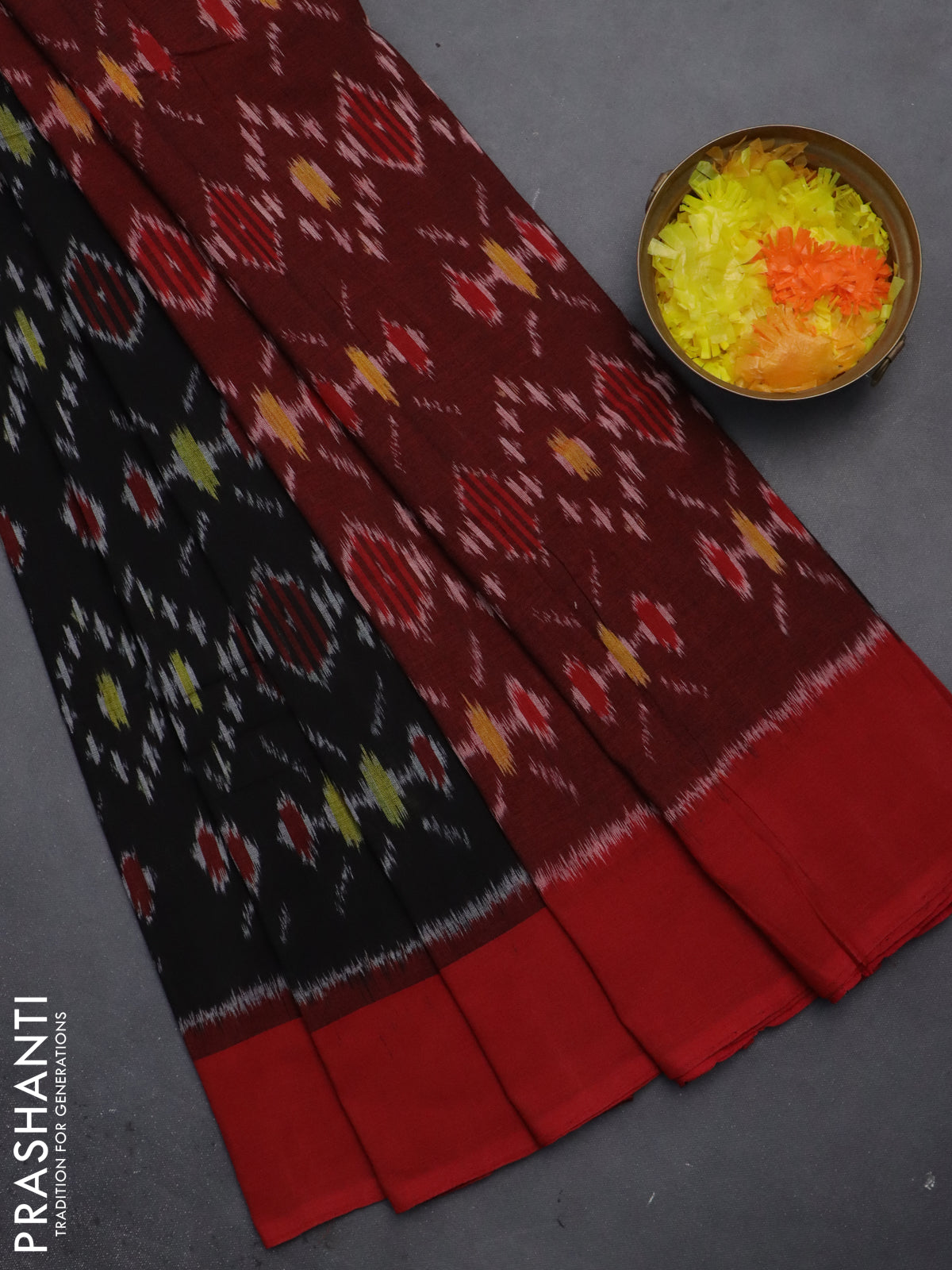 Ikat cotton saree black and red with allover ikat weaves and simple border
