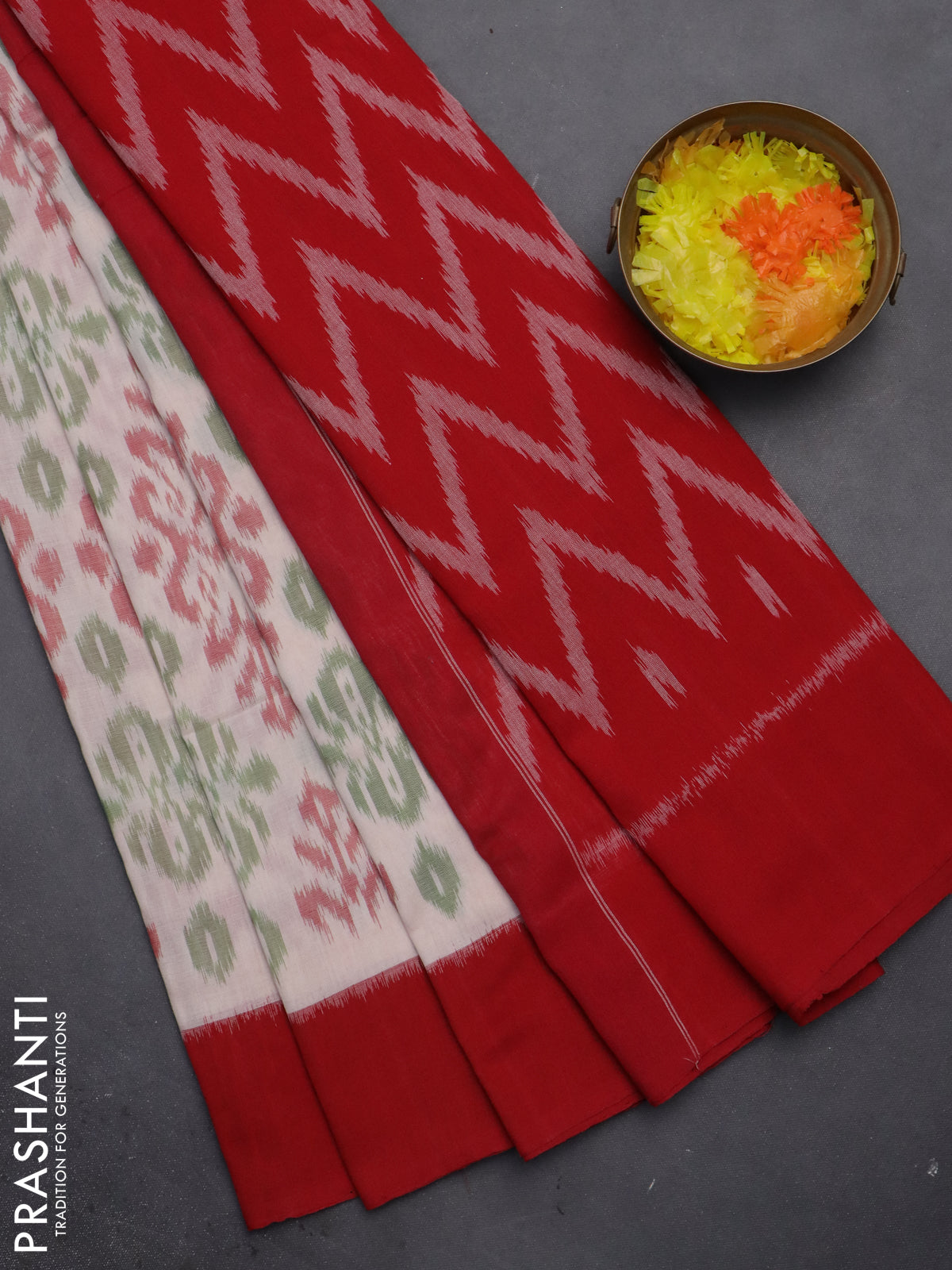 Ikat cotton saree cream and red with allover ikat weaves and simple border