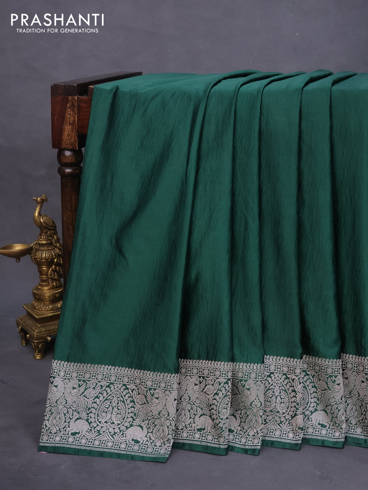 Banarasi crush crepe saree dark green with plain body and silver zari woven border