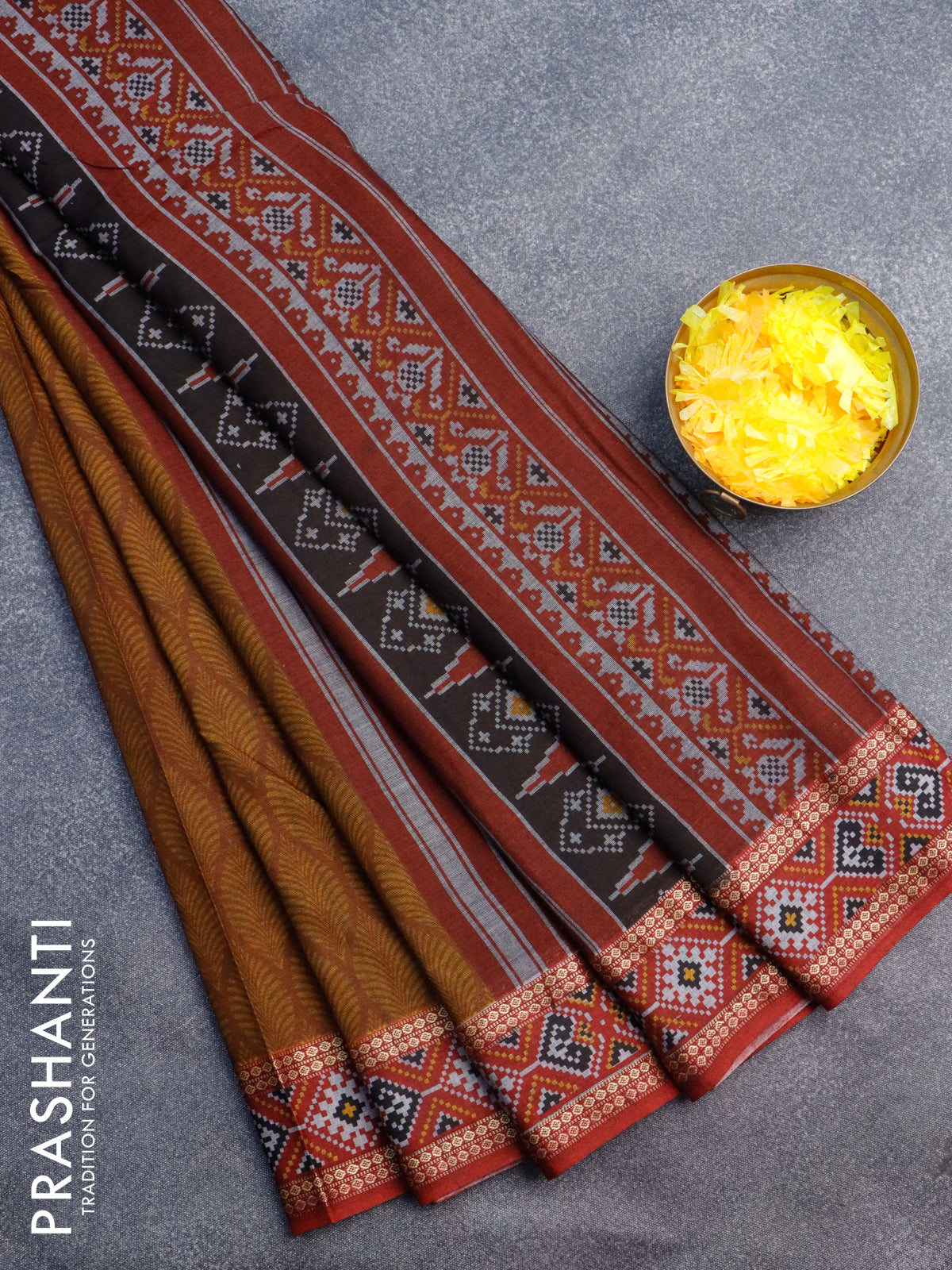 Muslin cotton saree dark mustard and maroon with allover prints and patola printed border