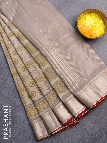 Chanderi silk cotton saree beige and maroon with natural vegetable prints and zari woven gotapatti lace border