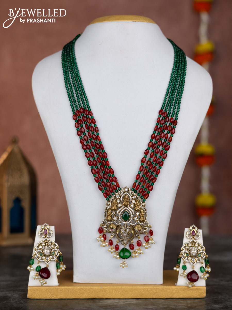 Beaded multilayer green red necklace lakshmi & ganesha pendant with emerald kundan & cz stones and pearl hangings in victorian finish