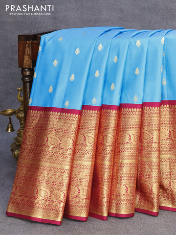 Pure gadwal silk saree light blue and dark magenta pink with zari woven buttas and zari woven border