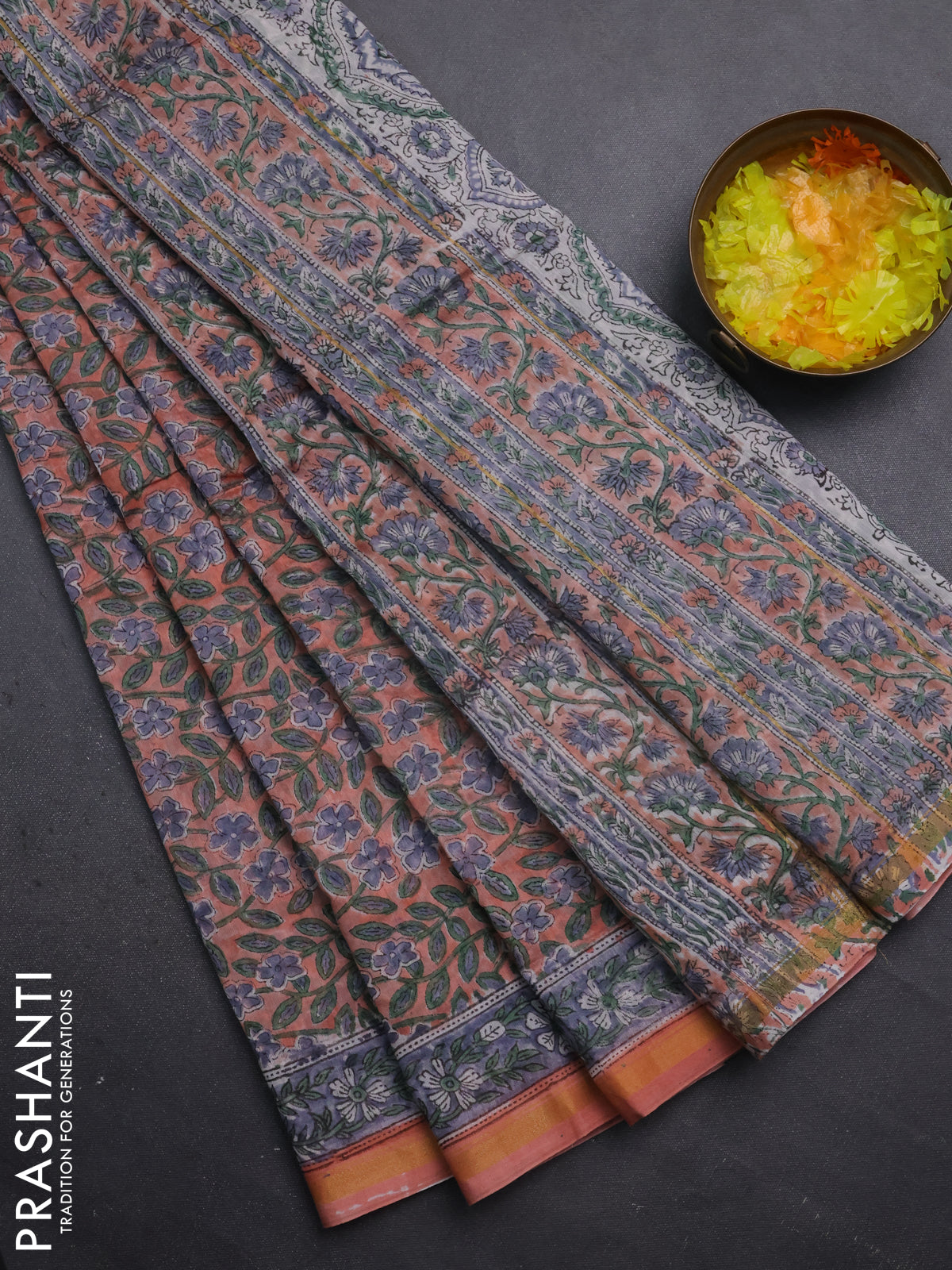 Chanderi bagru saree peach shade with allover floral prints and small zari woven border