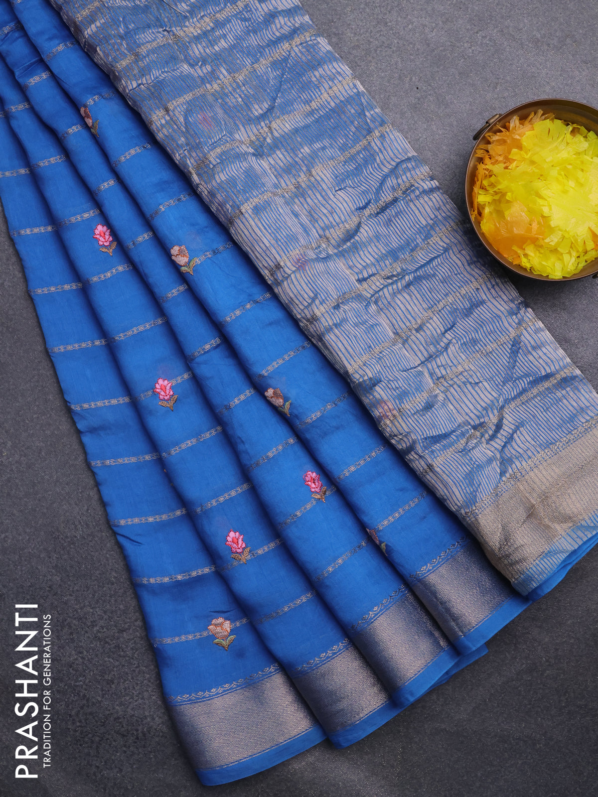 Assam silk saree cs blue with allover zari weaves & embroidery work buttas and zari woven border