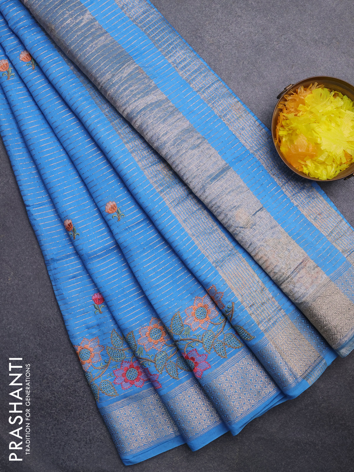 Assam silk saree light blue with allover zari weaves & floral embroidery work buttas and zari woven border