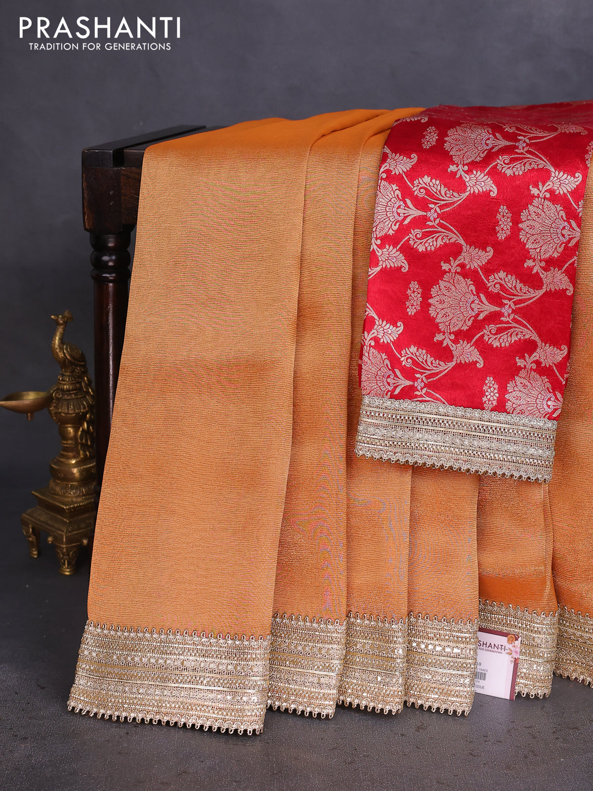 Banarasi tissue saree rust shade and red with plain body and lace work border