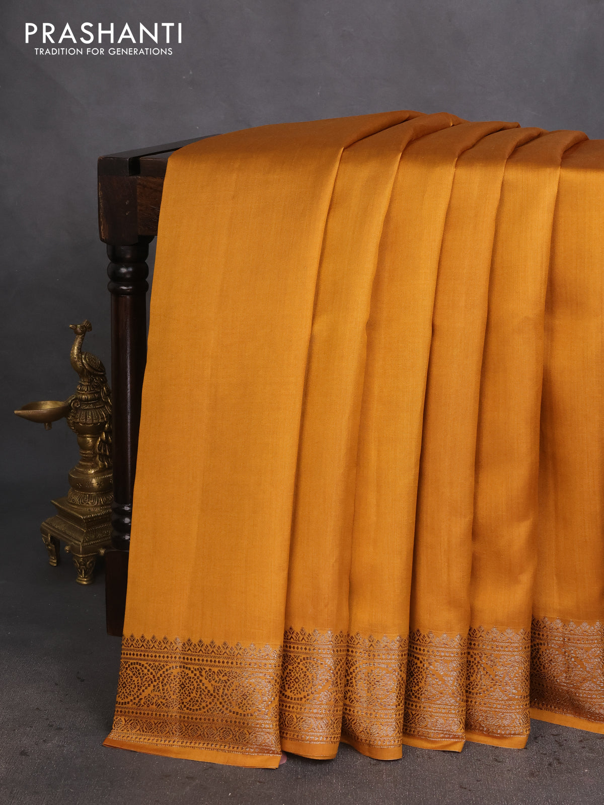 Chiniya silk saree dark mustard and rust shade with plain body and woven border