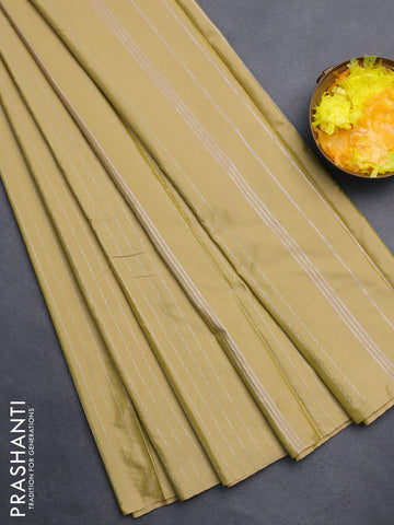 Arani semi silk saree elaichi green with allover silver zari weaves in borderless style