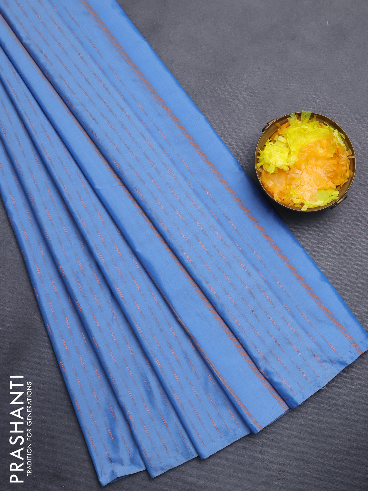 Arani semi silk saree blue shade with copper zari woven buttas in borderless style