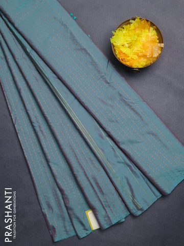 Arani semi silk saree dual shade of teal green with allover copper zari weaves in borderless style
