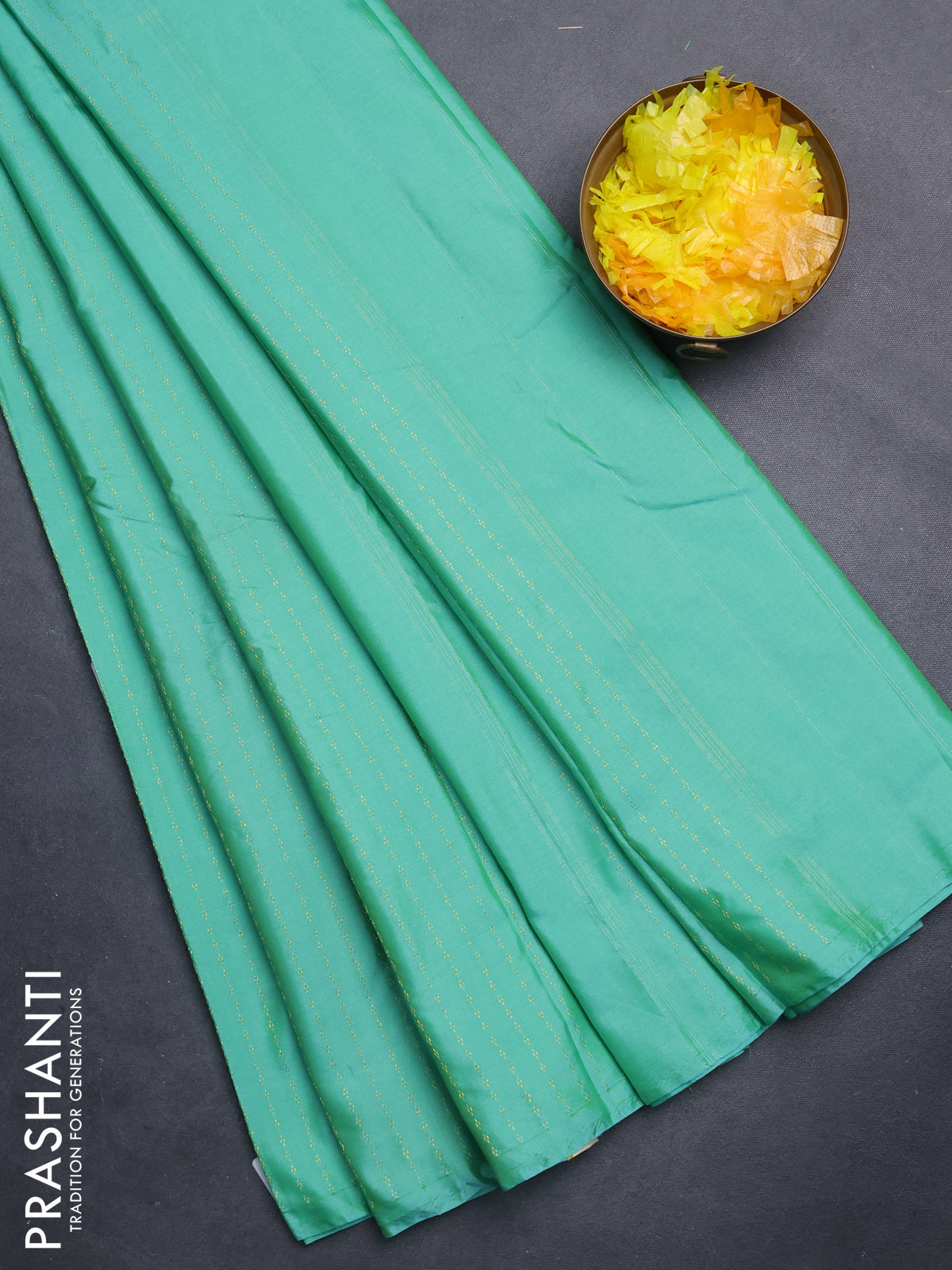 Arani semi silk saree teal green with allover zari weaves in borderless style