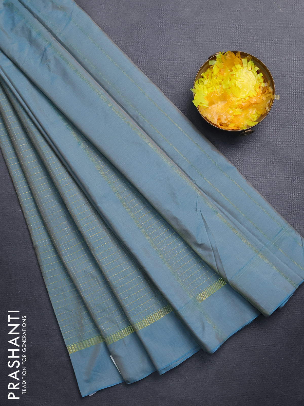 Arani semi silk saree teal blue shade with allover small zari checked pattern and zari woven simple border