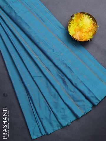 Arani semi silk saree dual shade of teal green with allover copper zari weaves in borderless style