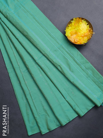 Arani semi silk saree teal green with allover silver zari weaves in borderless style