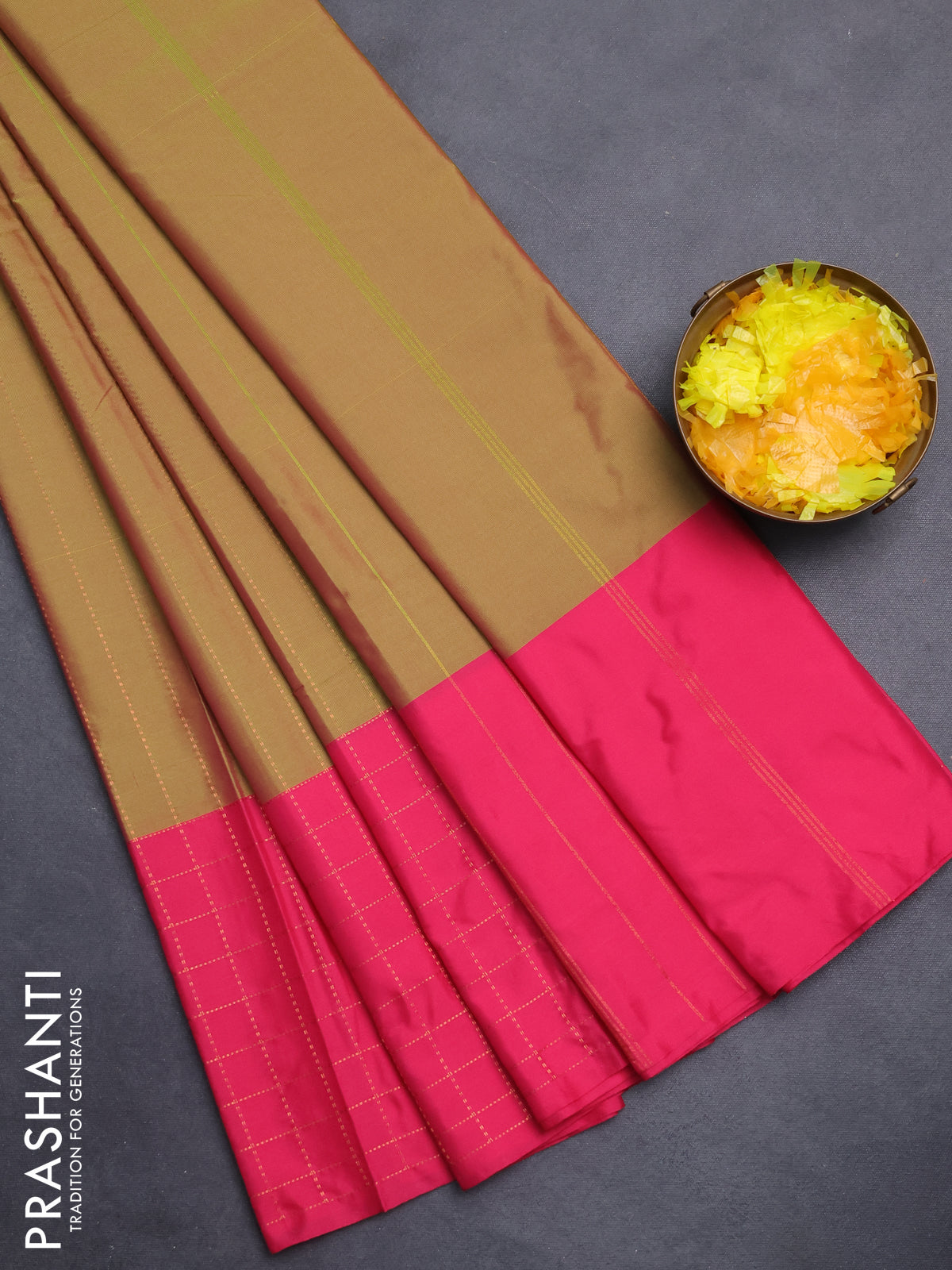 Arani semi silk saree dual shade of sap green and pink with allover copper zari weaves and zari checked border