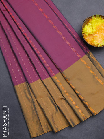 Arani semi silk saree dark purple and dark mustard with allover copper zari weaves and zari checked border