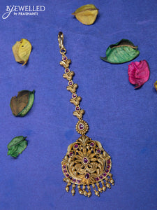 Antique maang tikka with pink kemp stones and golden beads hangings