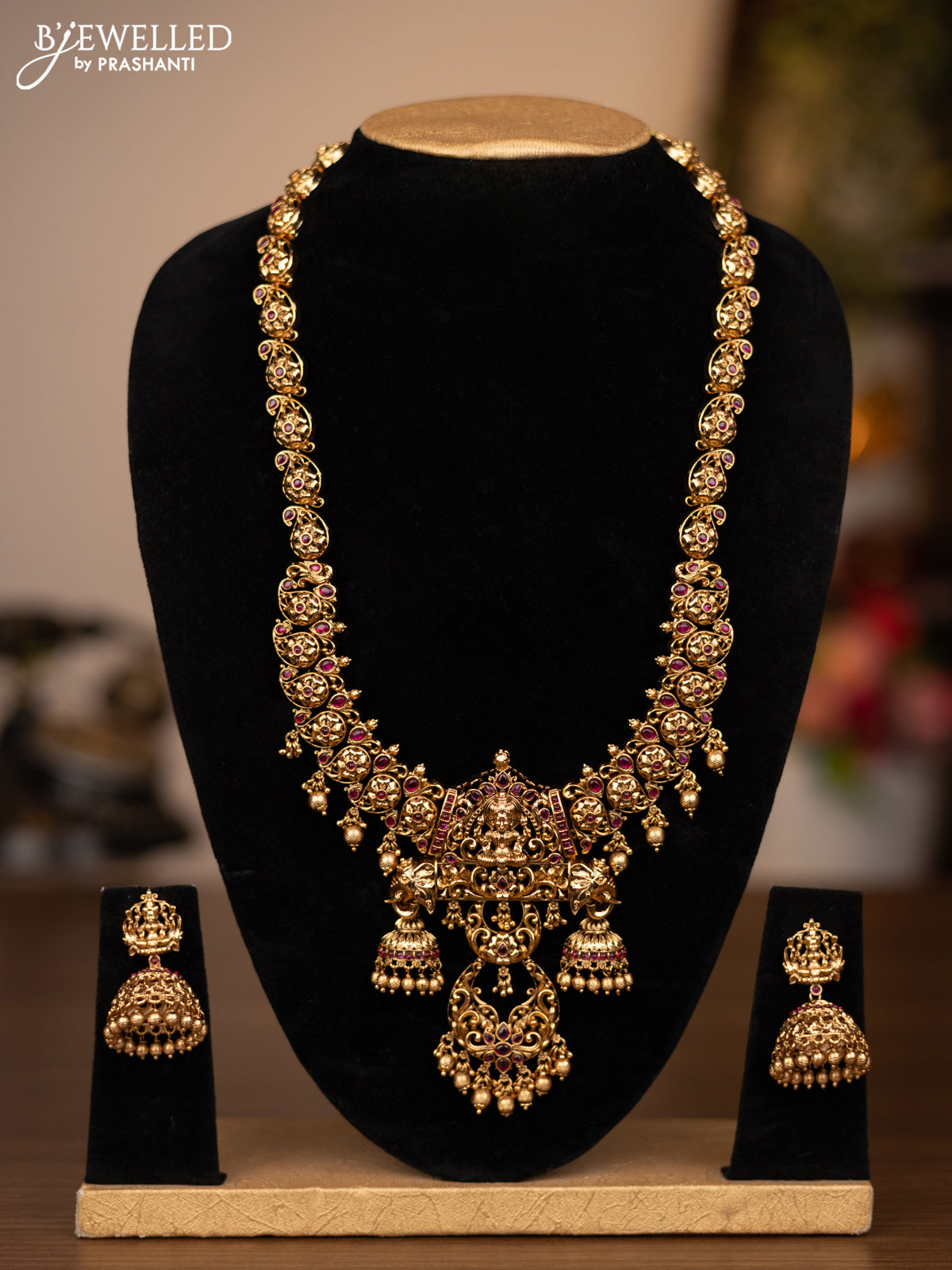 Antique haaram lakshmi design with pink jadau stones and golden beads hanging