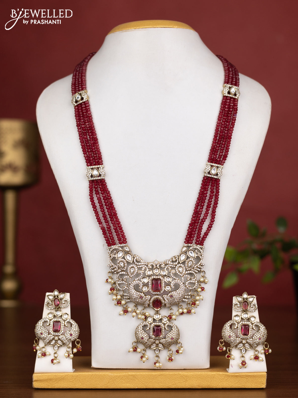 Beaded multilayer maroon necklace with ruby kundan & cz stones and pearl & beads hanging in victorian finish
