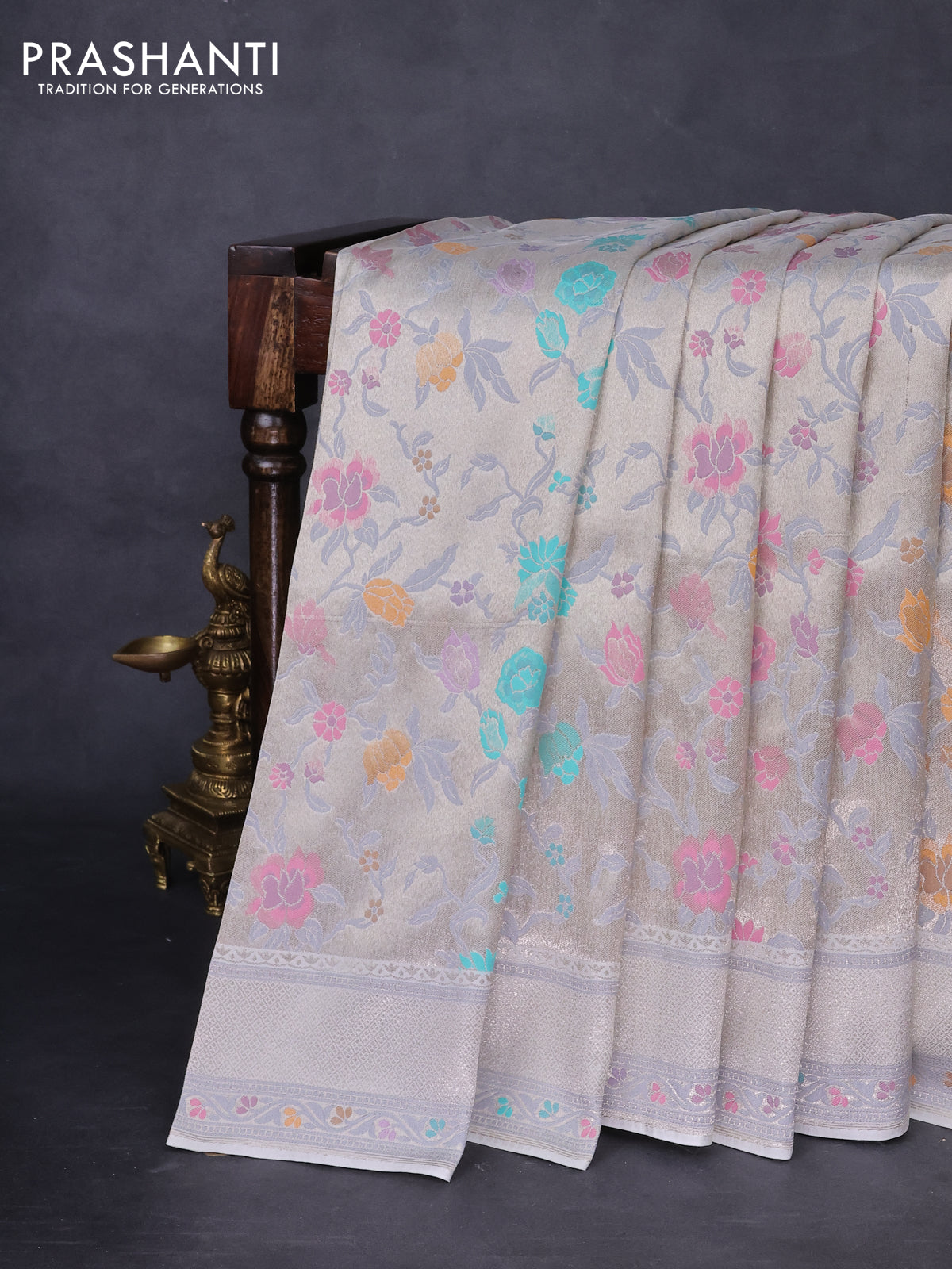 Banarasi tissue silk saree off white with allover thread woven floral weaves and silver zari woven border