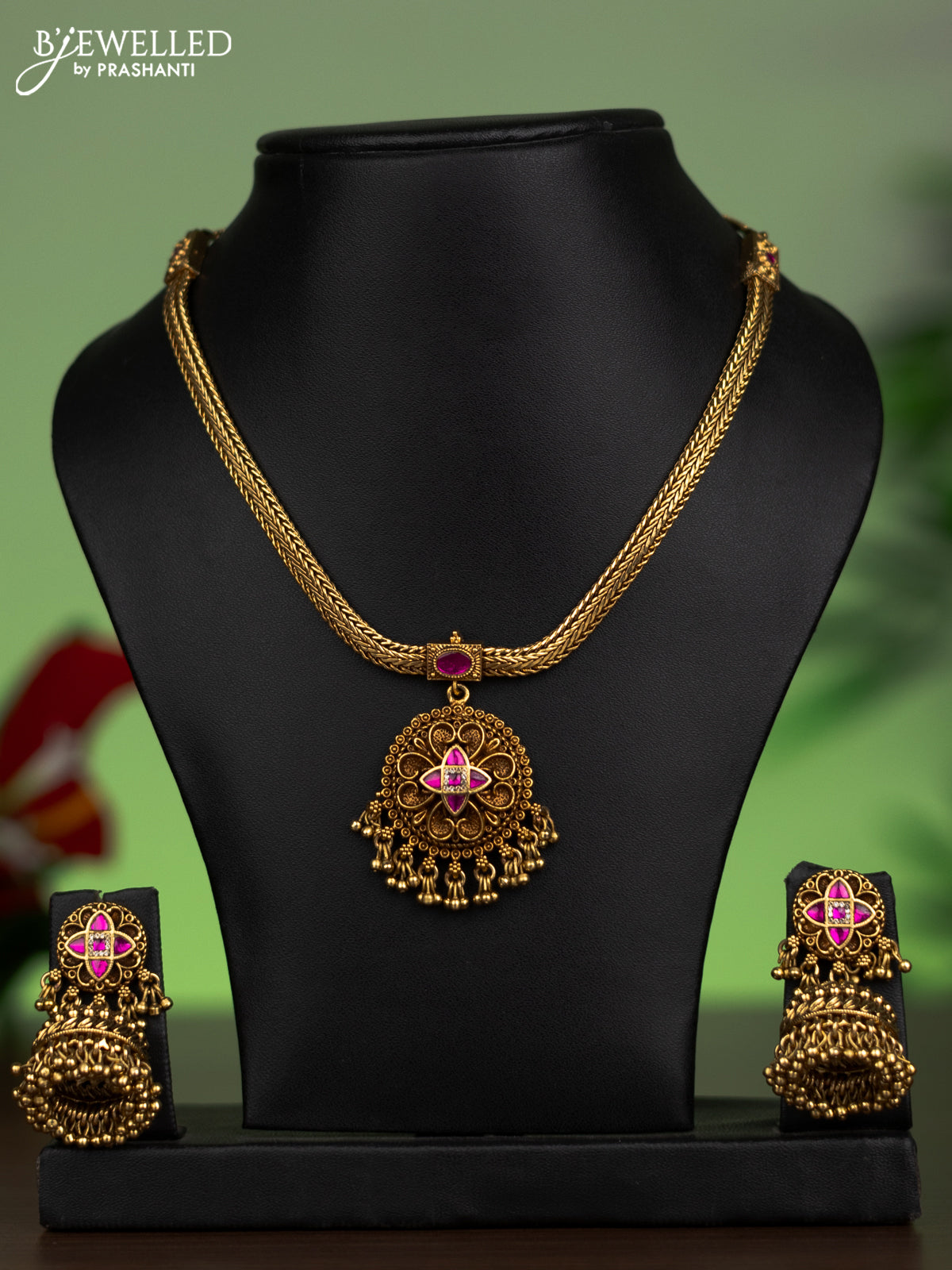 Jadau attigai necklace with pink jadau stones and golden beads hanging