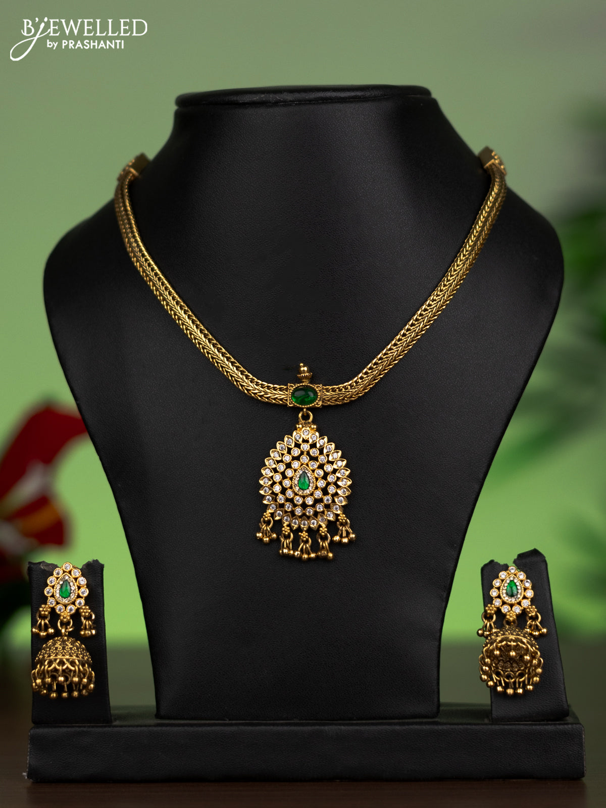 Jadau attigai necklace with green jadau & cz stones and golden beads hanging