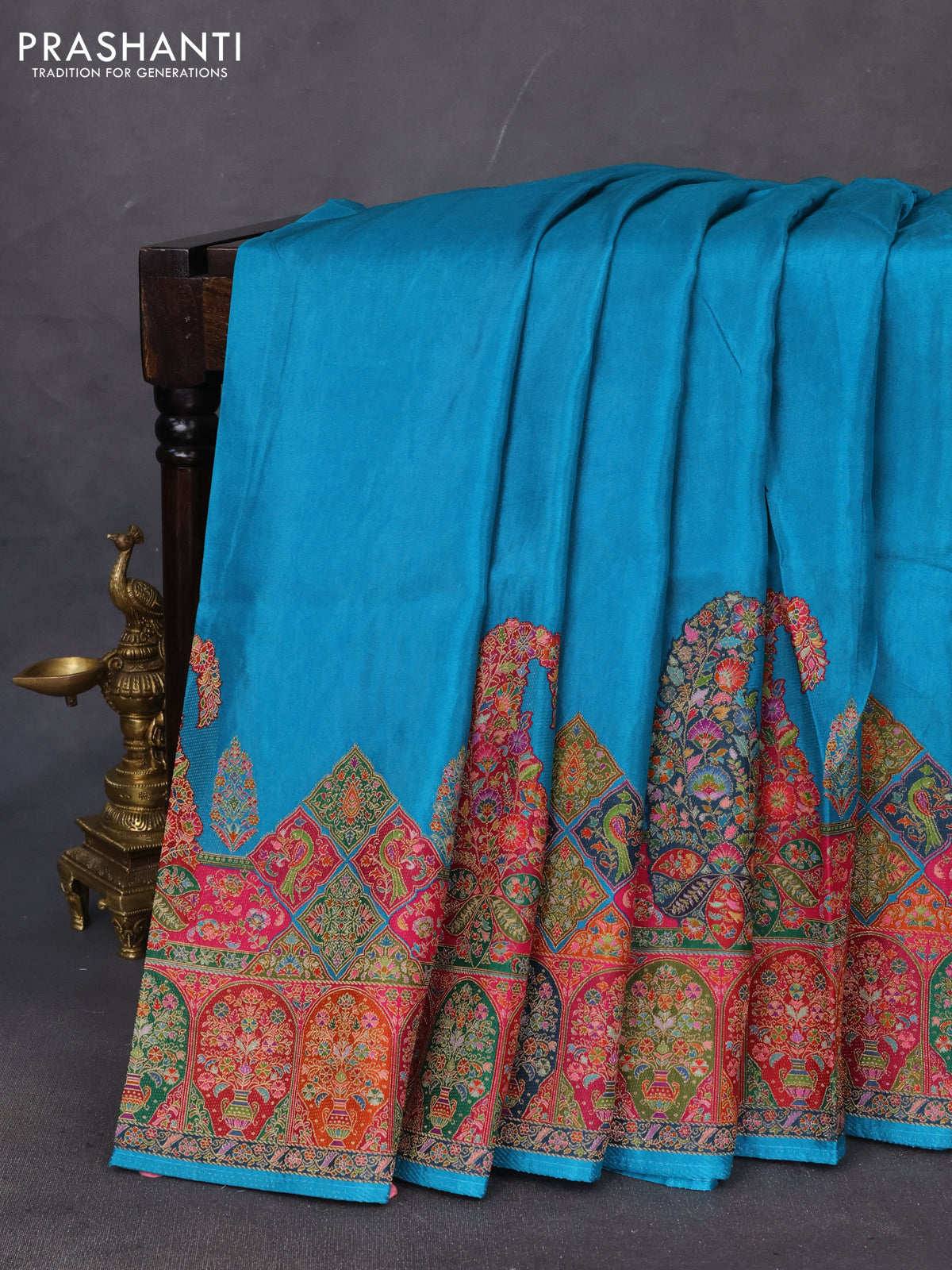 Banarasi silk saree teal blue with plain body and position prints