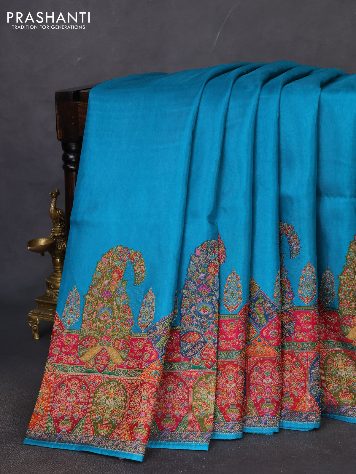 Banarasi silk saree teal blue with plain body and position prints