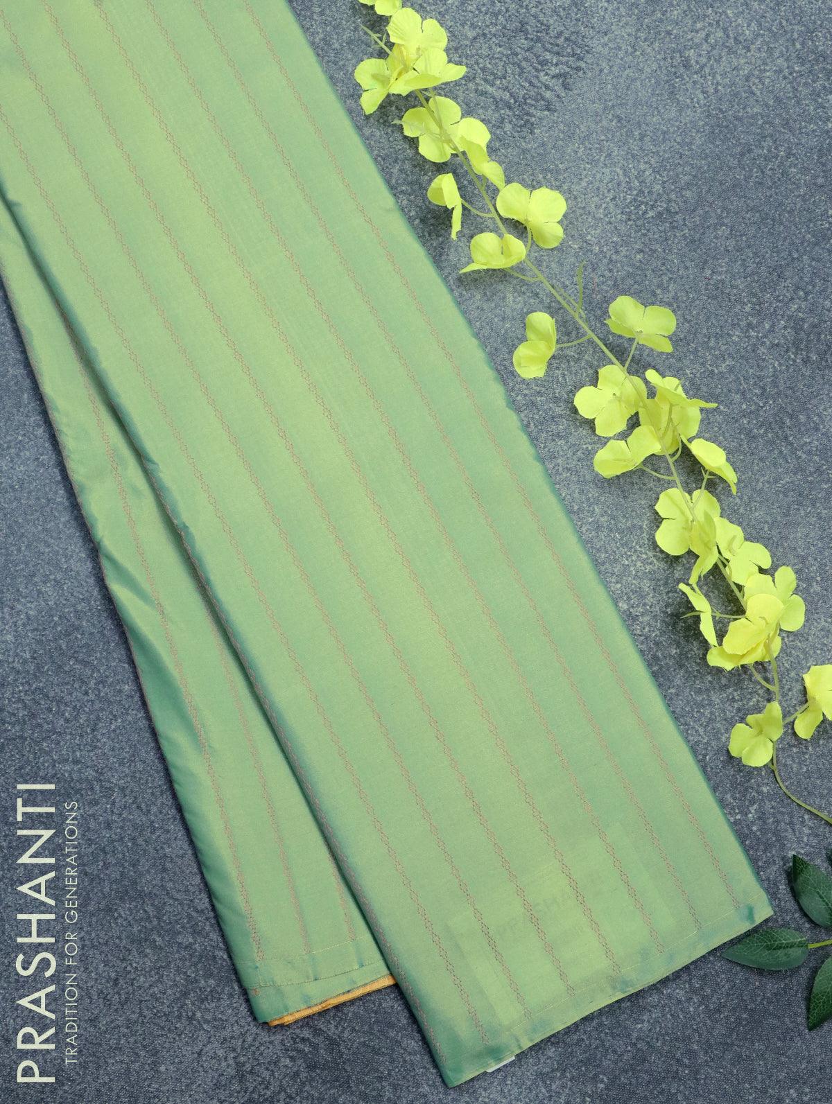 Arani semi silk saree dual shade of teal green and yellow shade with allover copper zari weaves in borderless style