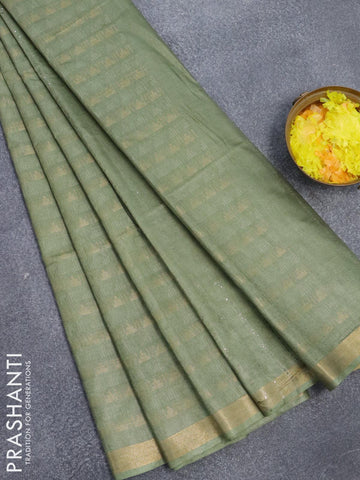 Bamboo silk saree pastel green with allover zari weaves and zari woven border