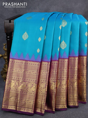 Pure gadwal silk saree light bluer and deep purple with zari woven buttas and temple design long annam zari woven border