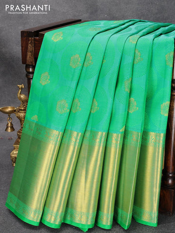 Pure kanjivaram silk saree dual shade of teal blue and green with allover self emboss & zari buttas and long zari woven border