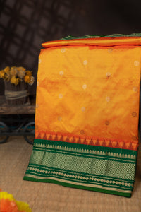 Varamahalakshmi Tangy Orange & Green Paithani Buttis Saree